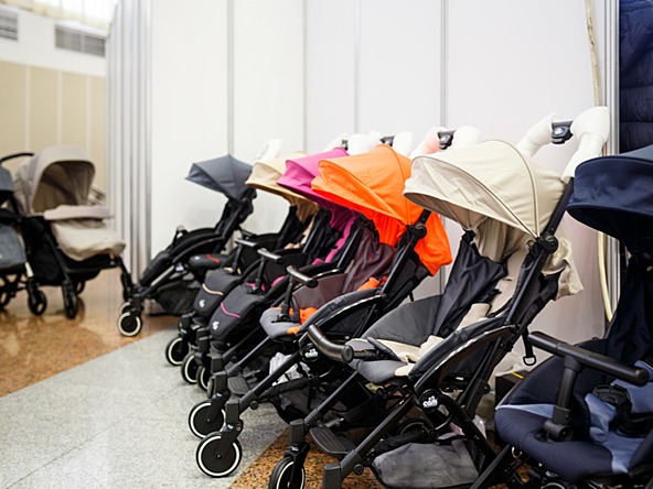 row of colourful prams in a shop